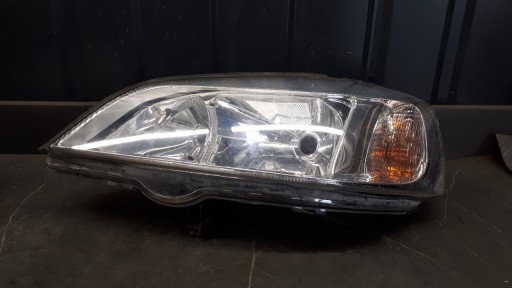 90520877 Lewy Scheinwerfer Opel Astra II G Hella